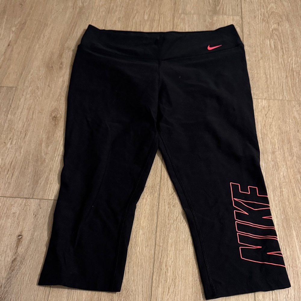 Nike women’s dark grey and pink Leggings